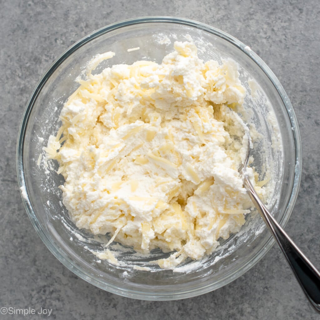 Overhead view of a mixing bowl of cheese filling for Lasagna Soup recipe.