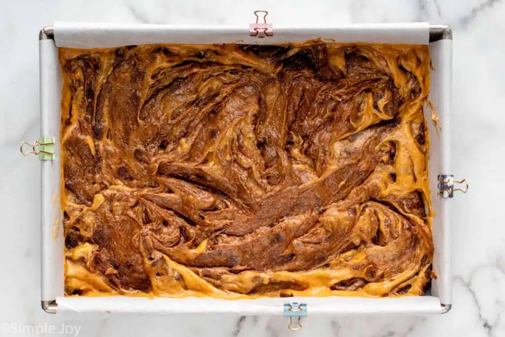 Overhead view of a baking dish of batter for Pumpkin brownies recipe.