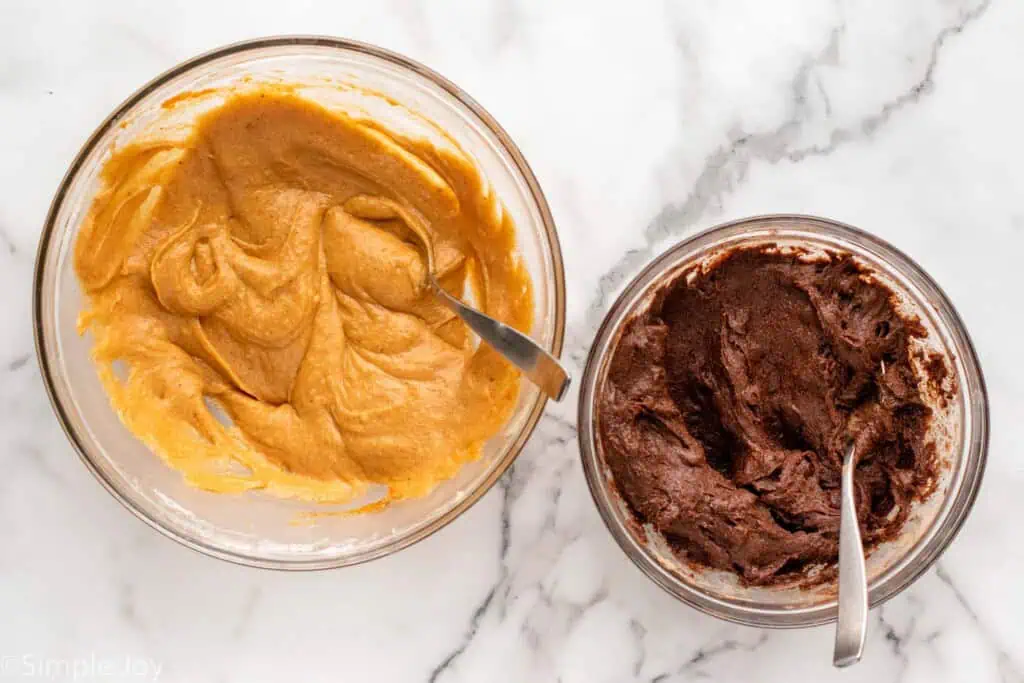 Overhead view of mixing bowls of batter for Pumpkin brownies recipe.