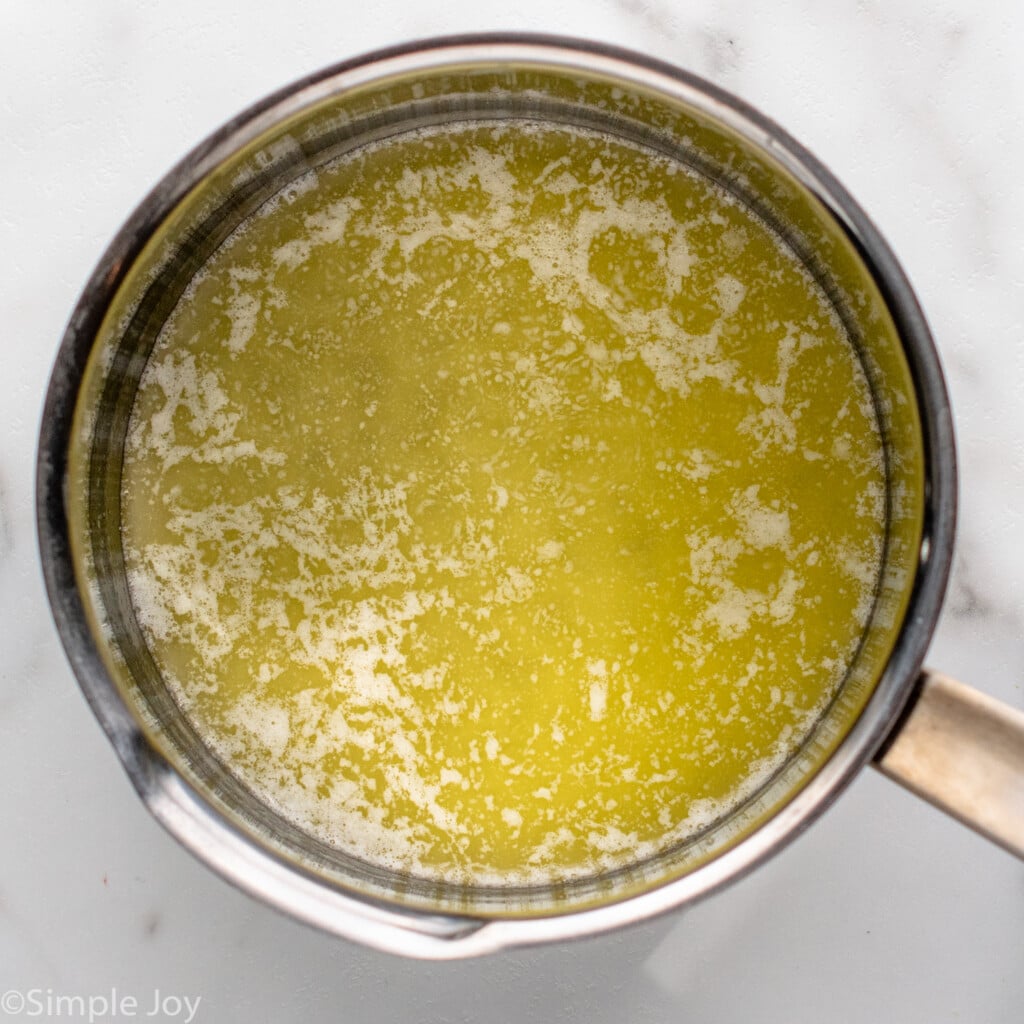 Overhead view of a saucepan of butter for sauce for Bread Pudding recipe - 10