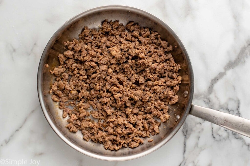 Overhead view of a skillet of cooked ground breakfast sausage for tater tot breakfast casserole recipe