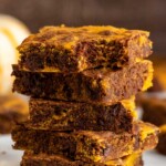 Close up side view of a stack of Pumpkin brownies with a bite taken out of the top brownie - 15