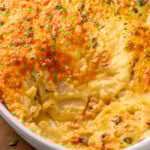 Baking dish of Potatoes Au Gratin with portion taken out. - 12