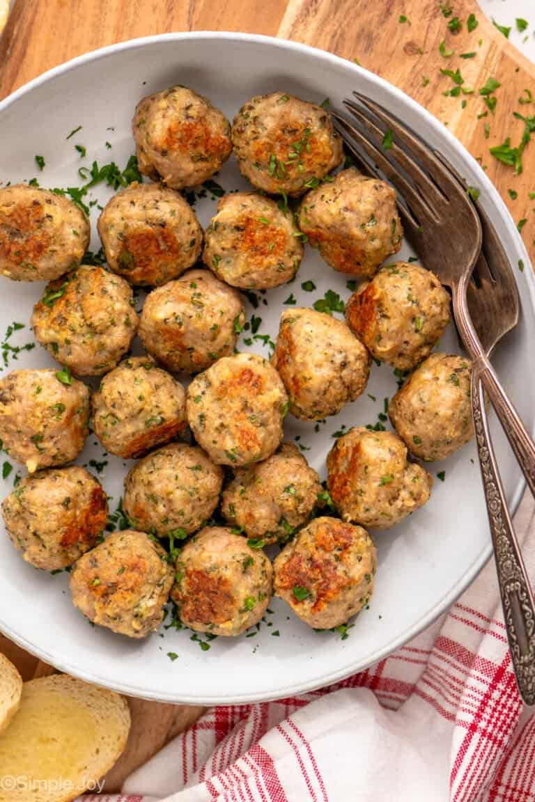 Overhead view of a bowl of Baked Turkey Meatballs with forks