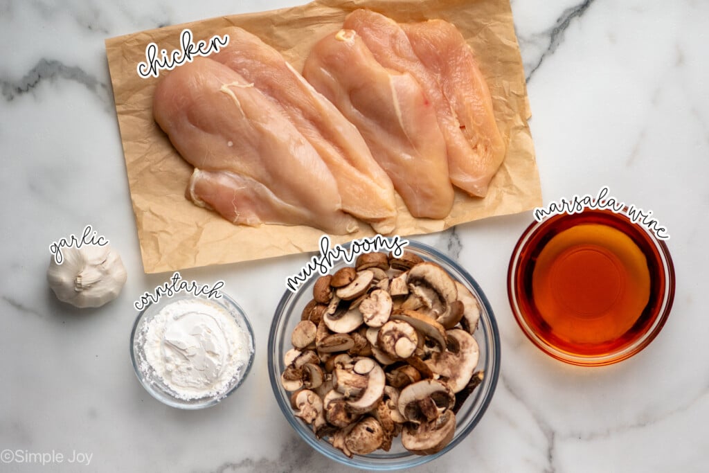 Overhead view of ingredients for Crock Pot Chicken Marsala recipe on countertop - 4