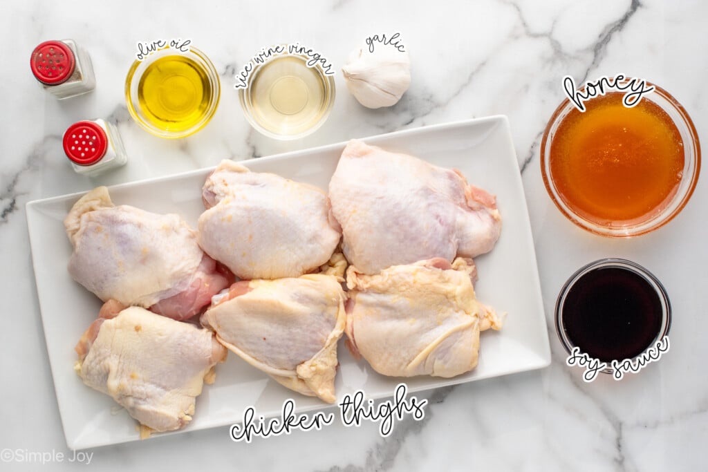 Overhead view of ingredients for Honey Garlic Chicken Thighs recipe on countertop.