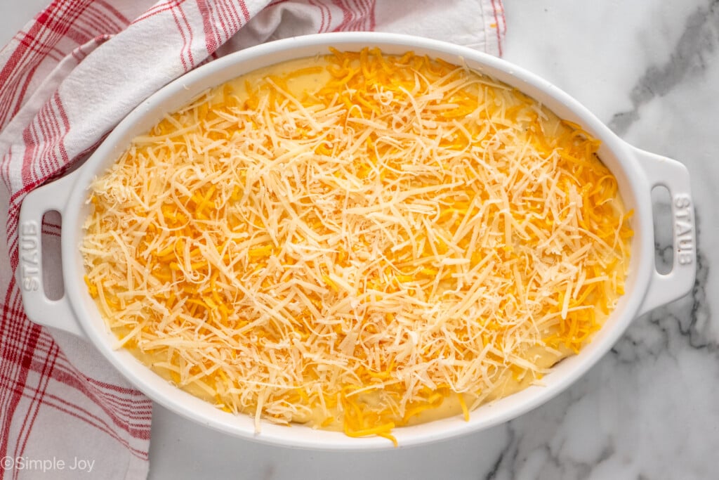 Overhead view of a baking dish of Potatoes Au Gratin recipe before baking - 9