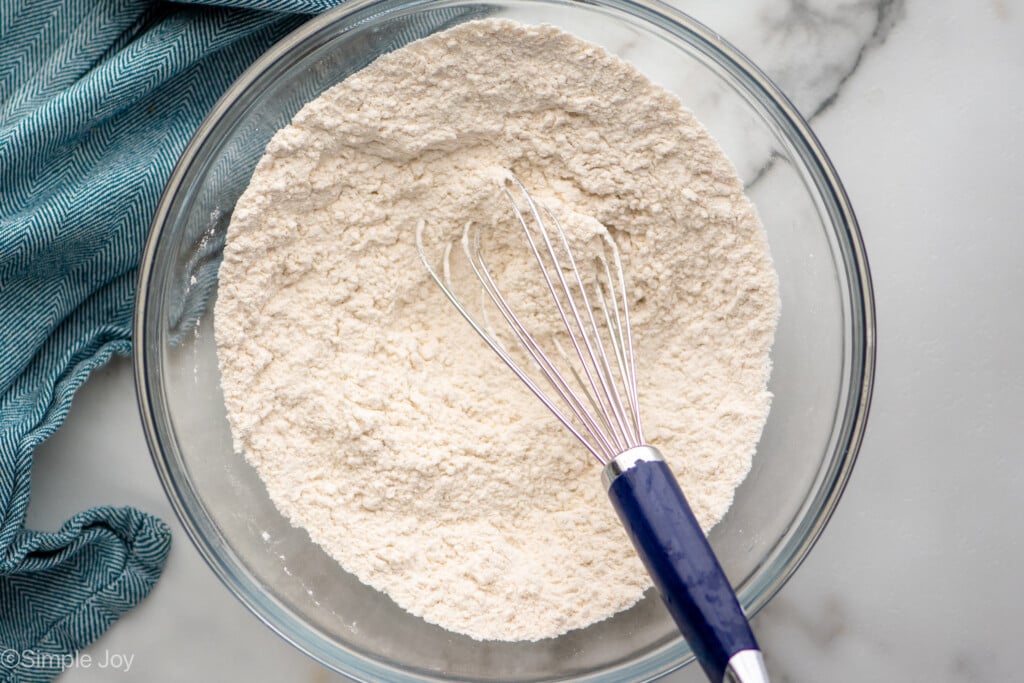 Overhead view of mixing bowl of dry ingredients and whisk for Brown Butter Chocolate Chip Cookies recipe - 7