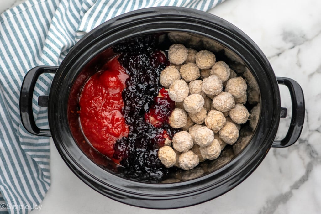 Overhead view of a crockpot of ingredients for Grape Jelly Meatballs recipe - 7