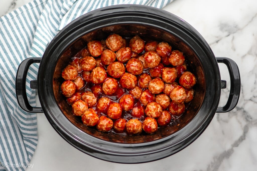 Overhead view of slow cooker of Grape Jelly Meatballs recipe - 8