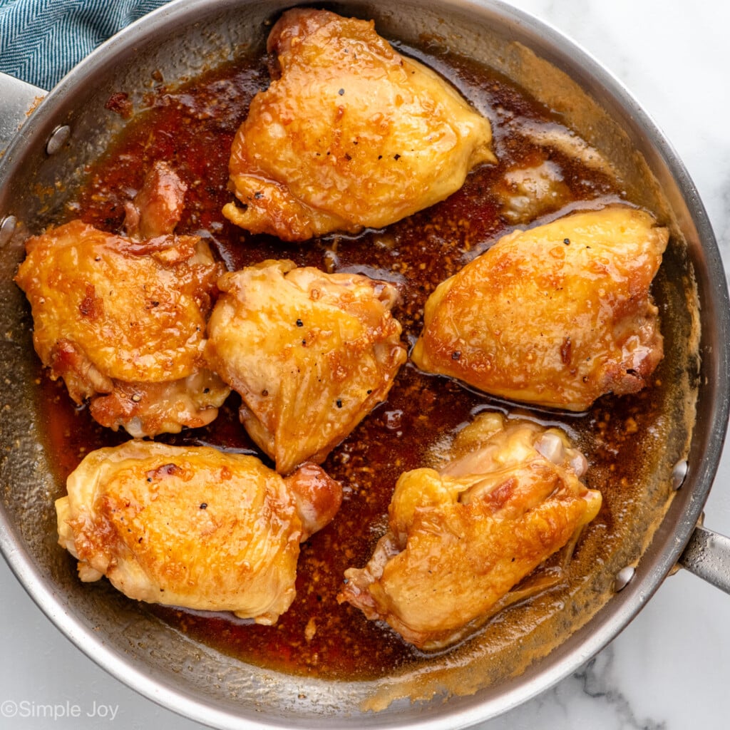 Overhead view of a skillet of Honey Garlic Chicken Thighs recipe