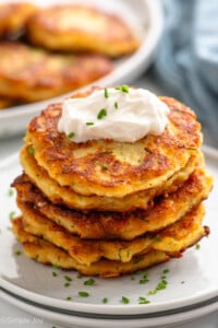 Stack of Mashed Potato Pancakes topped with sour cream and chopped chives - 10