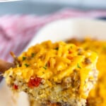 Pinterest graphic for Hashbrown Breakfast Casserole recipe. Text says, "Hashbrown Breakfast Casserole simplejoy.com." Image shows piece of Hashbrown Breakfast Casserole being lifted from casserole dish.