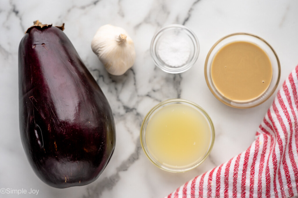 Overhead view of ingredients for Baba Ganoush recipe on countertop - 4