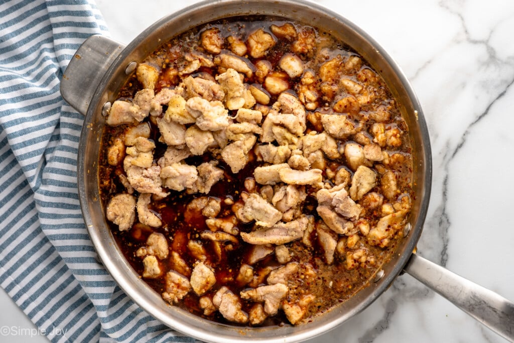 Overhead view of skillet of Bourbon Chicken recipe cooking - 10