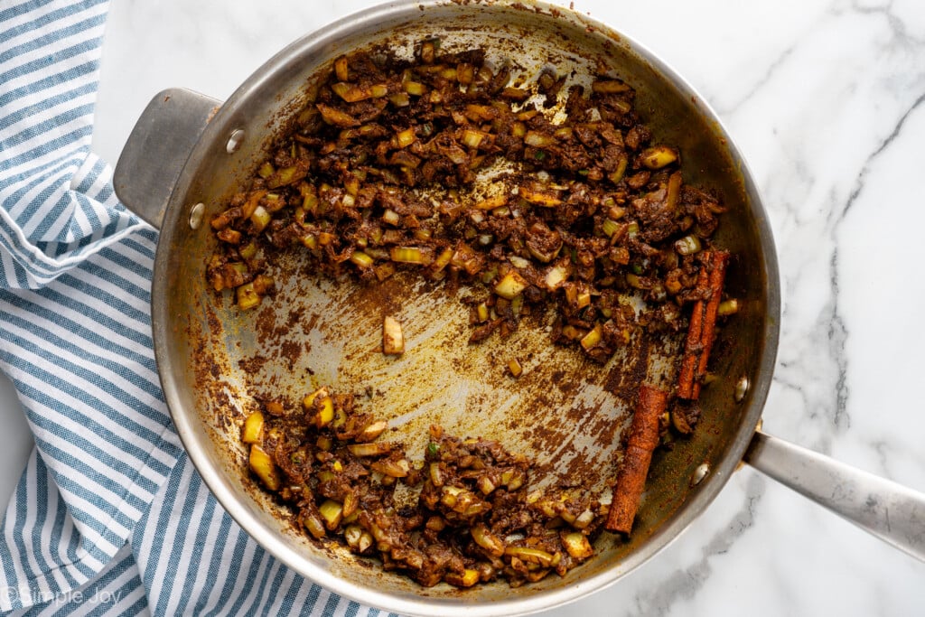 Overhead view of ingredients for Chicken Curry recipe in skillet - 6