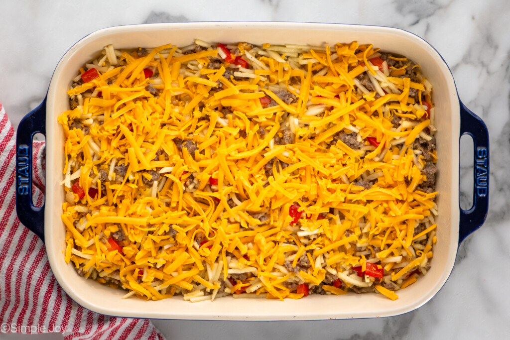 Overhead view of a baking dish of Hashbrown Breakfast Casserole before baking - 11