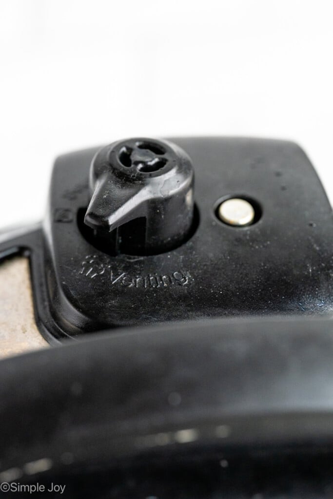 Close up view of Instant Pot valve shown for Instant Pot Steel Cut Oats recipe - 8