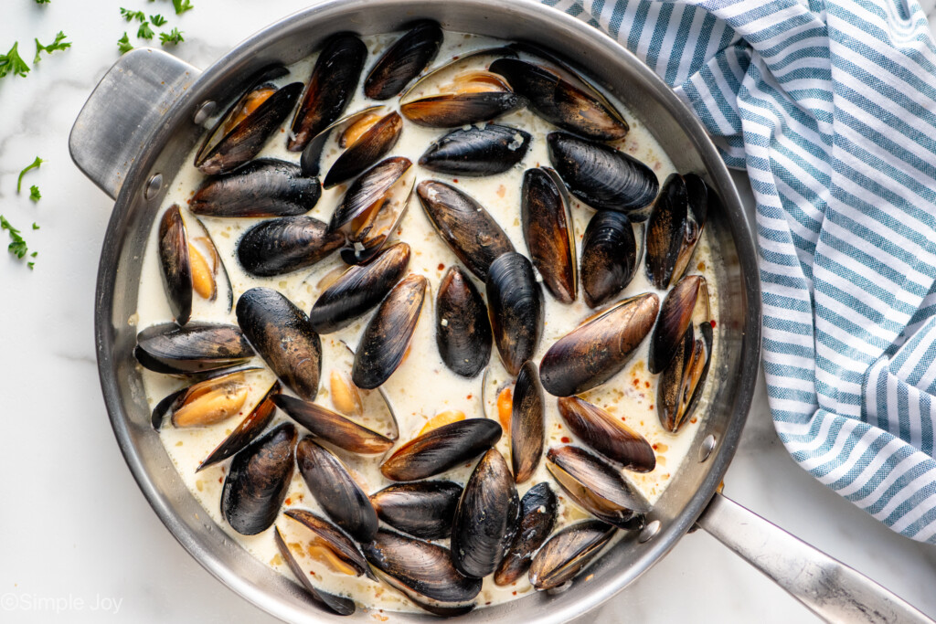 Overhead view of a skillet of Mussels recipe. - 8