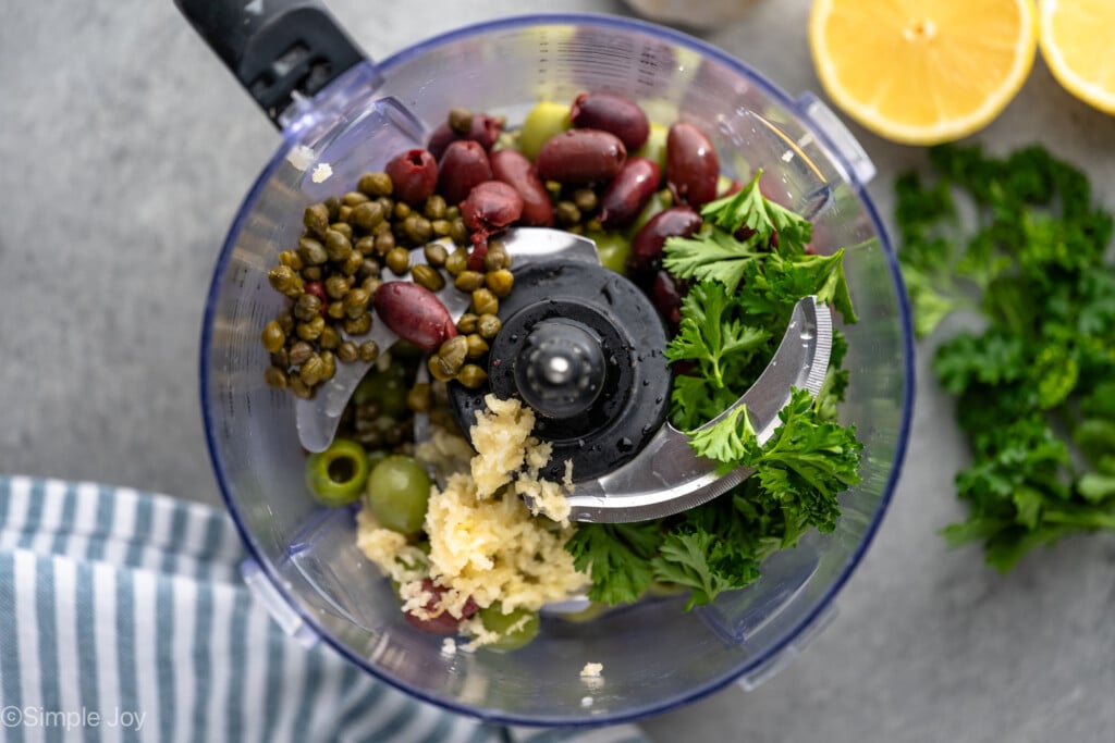 Overhead view of food processor with ingredients for Olive Tapenade before blending. - 6