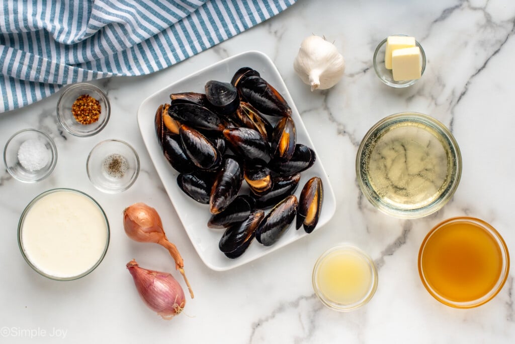 Overhead view of ingredients on countertop for Mussels recipe - 5