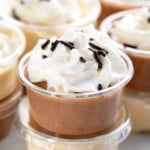 Stacks of Pudding Shots garnished with whipped cream and sprinkles - 11