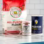 Pinterest graphic for Self Rising Flour recipe. Image shows ingredients for Self Rising Flour recipe on countertop. Text says, "how to make Self Rising Flour simplejoy.com."