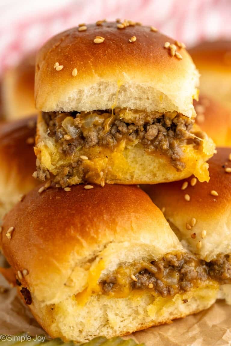 Stack of Cheeseburger Sliders garnished with sesame seeds