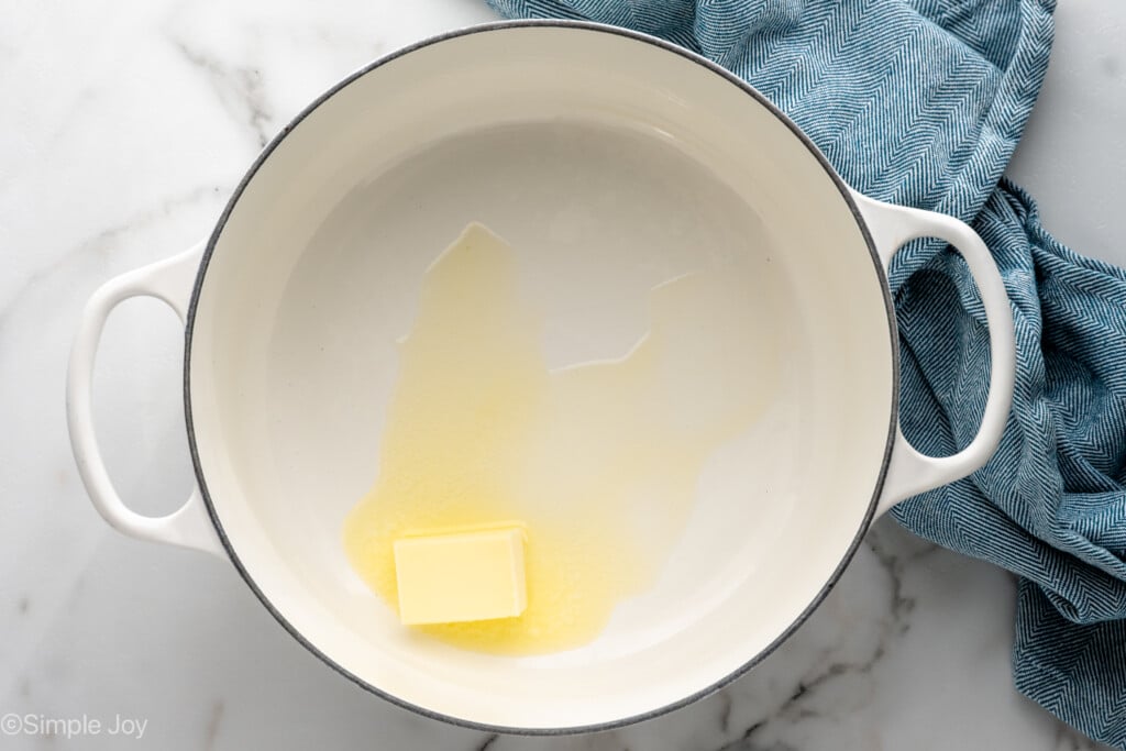 Overhead view of a large pot with butter melting for Oreo Rice Krispie Treats recipe - 4