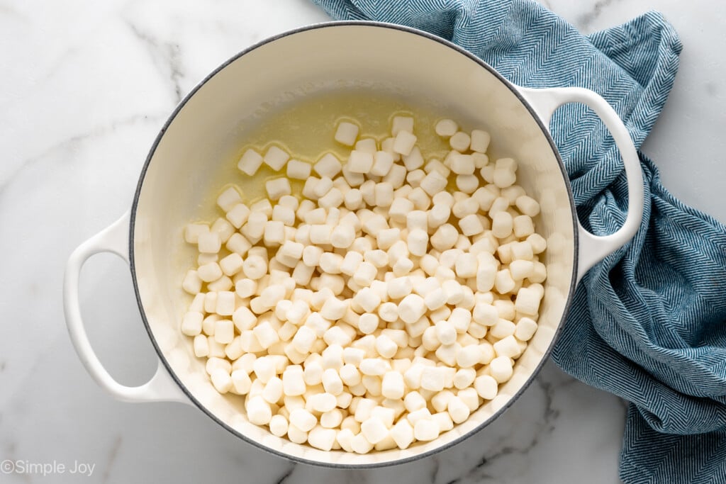 Overhead view of a large pot with marshmallows and butter melting for Oreo Rice Krispie Treats recipe - 5