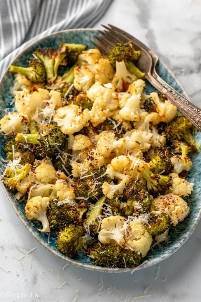 Bowl of Roasted Broccoli and Cauliflower garnished with parmesan cheese - 7