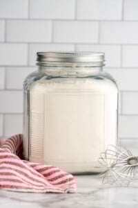 Canister of Self Rising Flour with whisk beside - 8