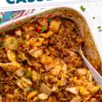 Pinterest graphic for cabbage roll casserole recipe. Text says, "easy delicious cabbage roll casserole simplejoy.com." Image shows overhead view of a baking dish of cabbage roll casserole recipe with spoon for serving.