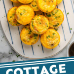 Pinterest graphic for Cottage Cheese Egg Bites recipe. Image shows a platter of Cottage Cheese Egg Bites topped with herbs. Text says, "Cottage Cheese Egg Bitessimplejoy.com"