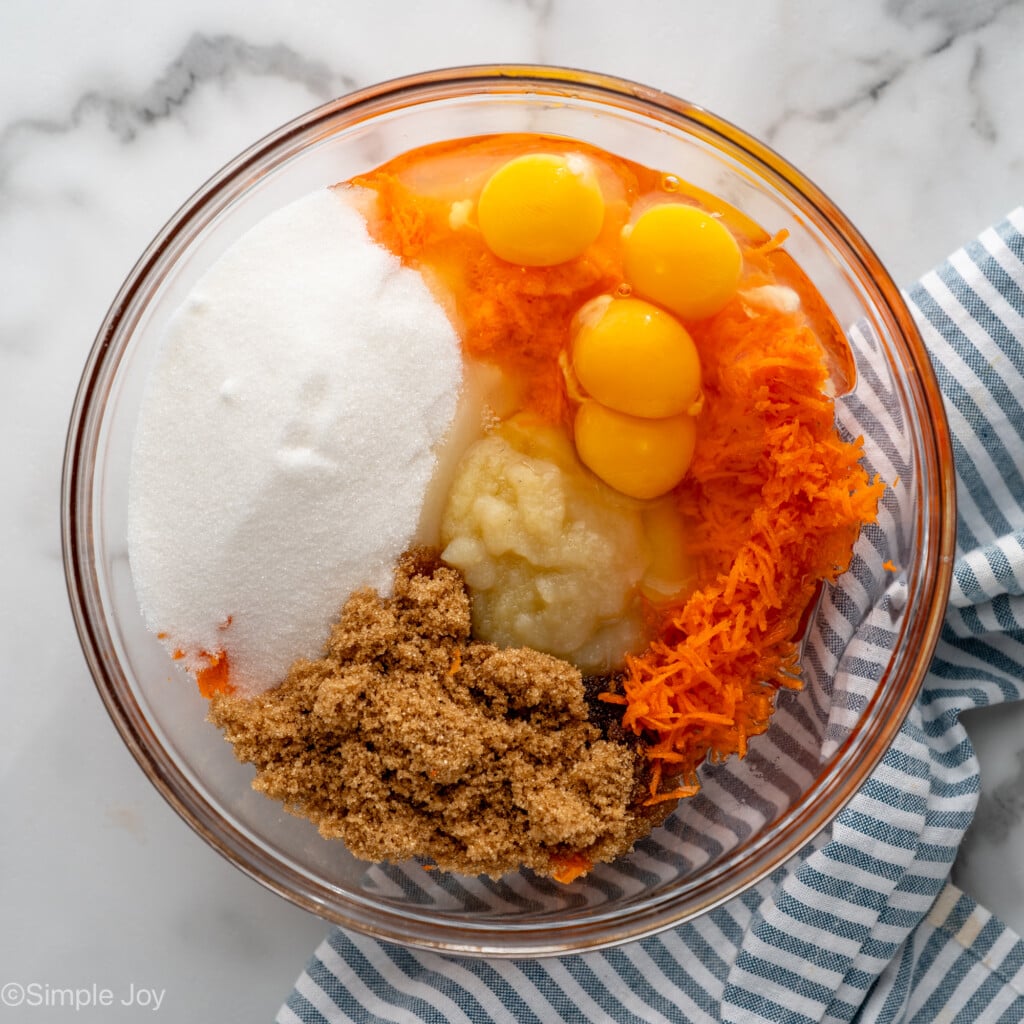 Overhead view of a mixing bowl of ingredients for Carrot Cake Cupcakes recipe
