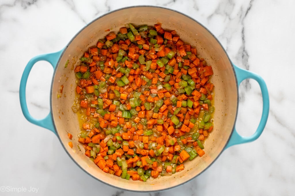 Overhead view of pot of chopped vegetables and seasonings cooking for Chicken Pot Pie recipe