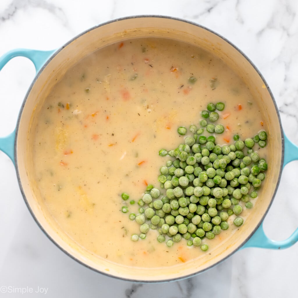 Overhead view of a pot of ingredient with peas for Chicken Pot Pie filling recipe