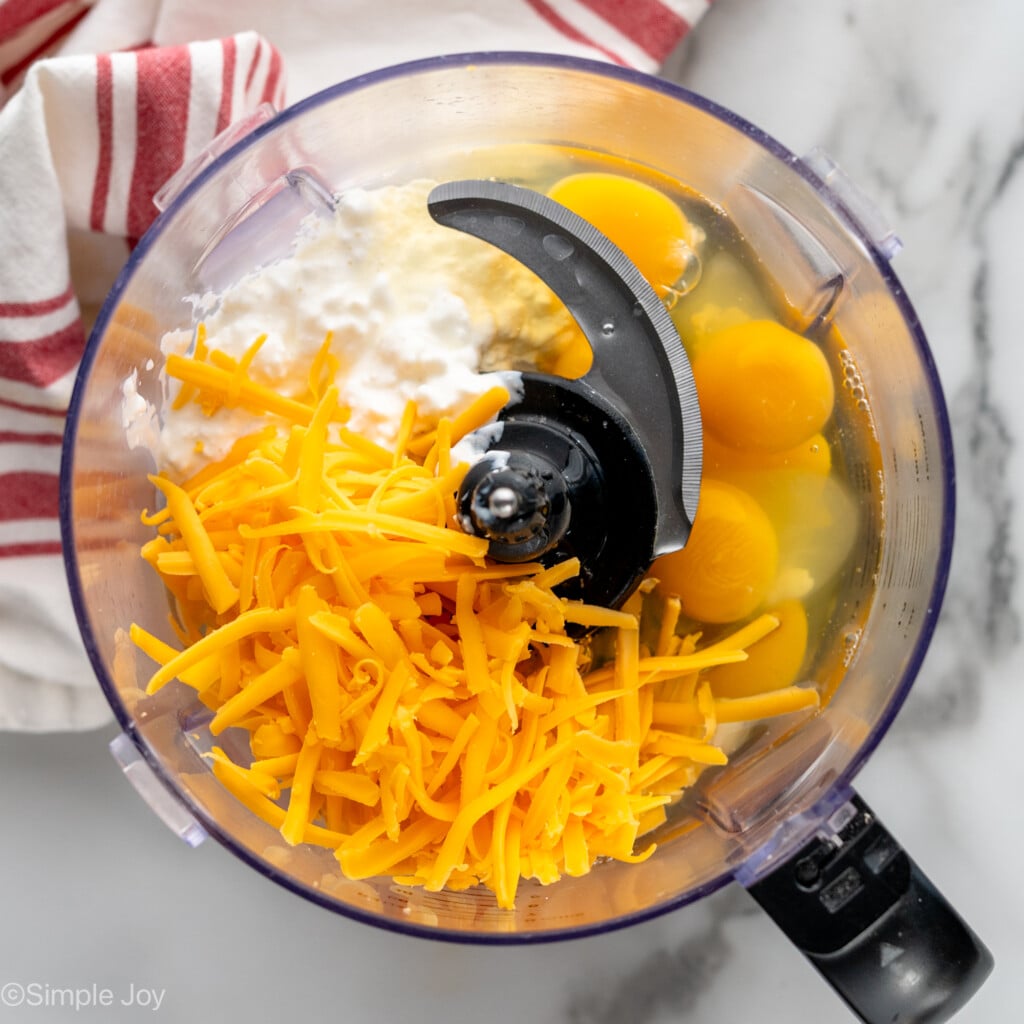 Overhead view of ingredients in food processor for Cottage Cheese Egg Bites recipe
