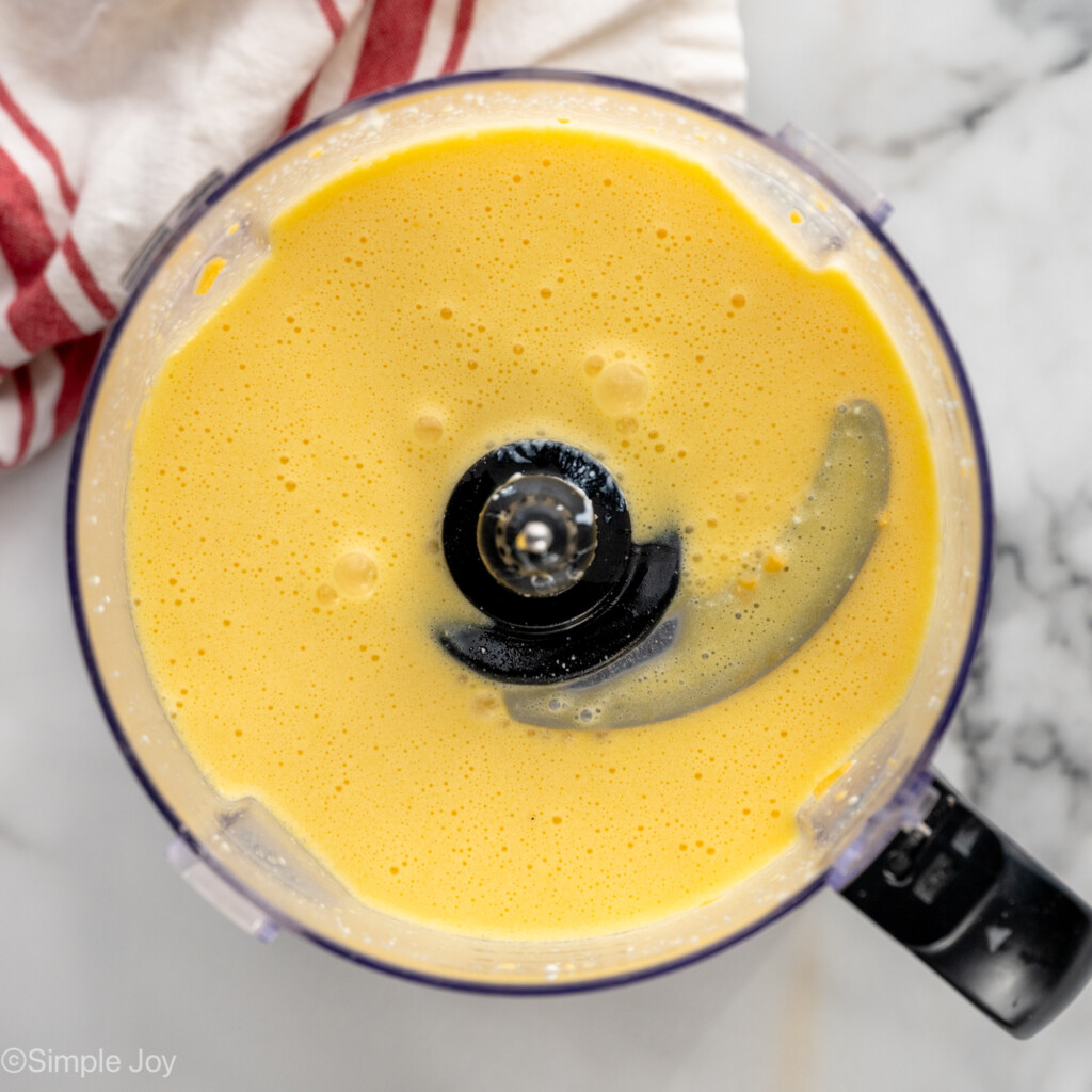 Overhead view of food processor with ingredients for Cottage Cheese Egg Bites recipe