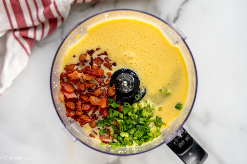 Overhead view of food processor with ingredients for Cottage Cheese Egg Bites recipe