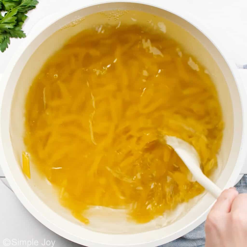overhead of a pot of boiling penne noodles