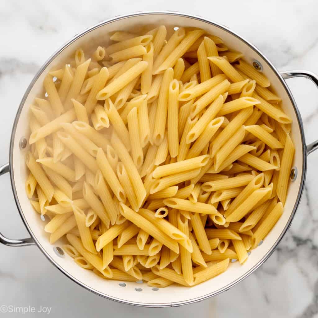cooked penne in a colander