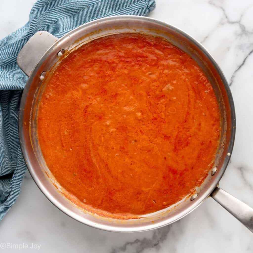 overhead of skillet with tomato sauce
