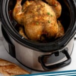 Pinterest graphic for crockpot chicken. Image shows a slow cooker with a cooked whole chicken. Says " Crockpot Chicken simplejoy.com"
