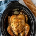 Pinterest graphic for Crockpot Whole Chicken. Says "slow cooker chicken recipe simplejoy.com" Image shows overhead of slow cooker with cooked Whole Chicken