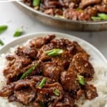 Pinterest graphic for Mongolian Beef. Says "the best Mongolian Beef simplejoy.com" Image shows a plate of Mongolian Beef over white rice.
