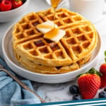 pinterest graphic of two waffles on a white plate with butter and syrup being poured over them, says: the best waffles, simplejoy.com