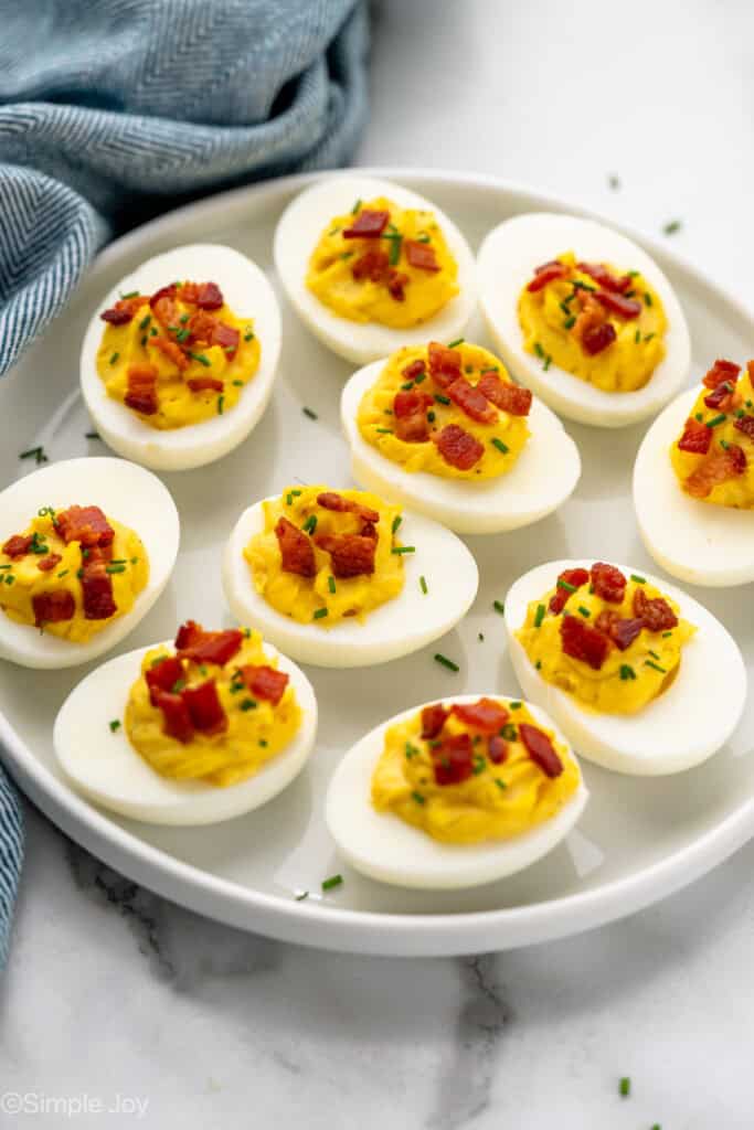 Platter of Deviled Eggs with Bacon topped with fresh chives