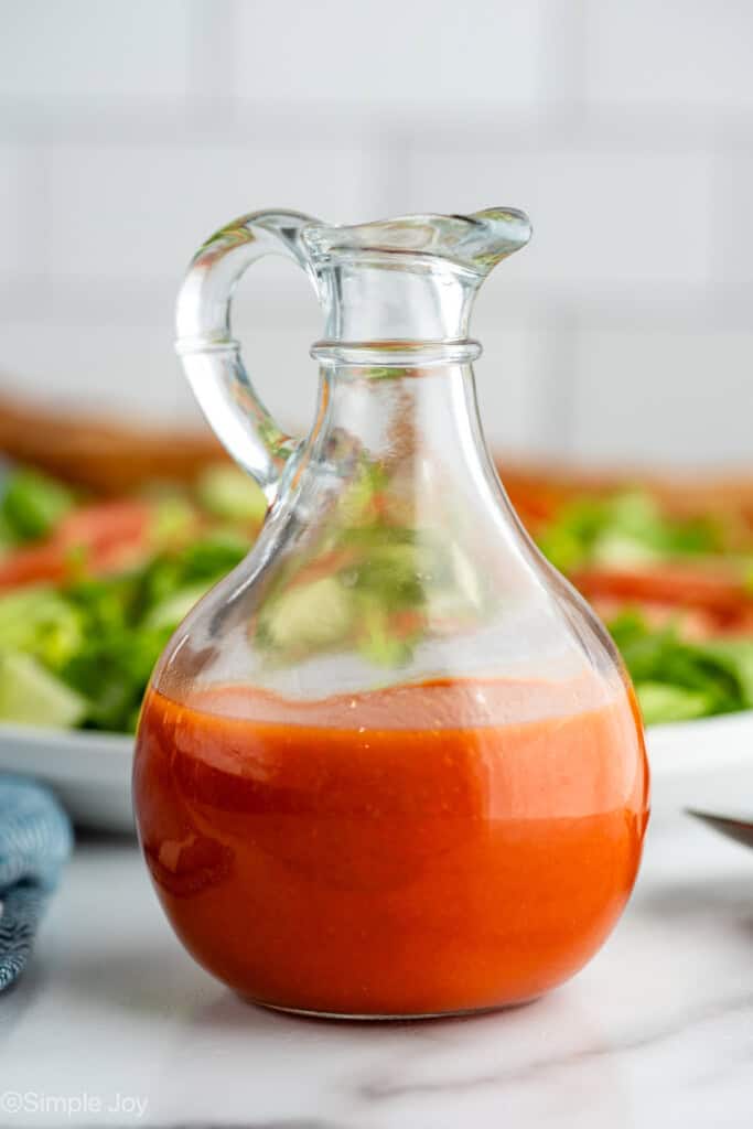 Jar of Catalina Dressing with salad in background