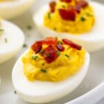 Close up view of Deviled Eggs with Bacon topped with fresh chives